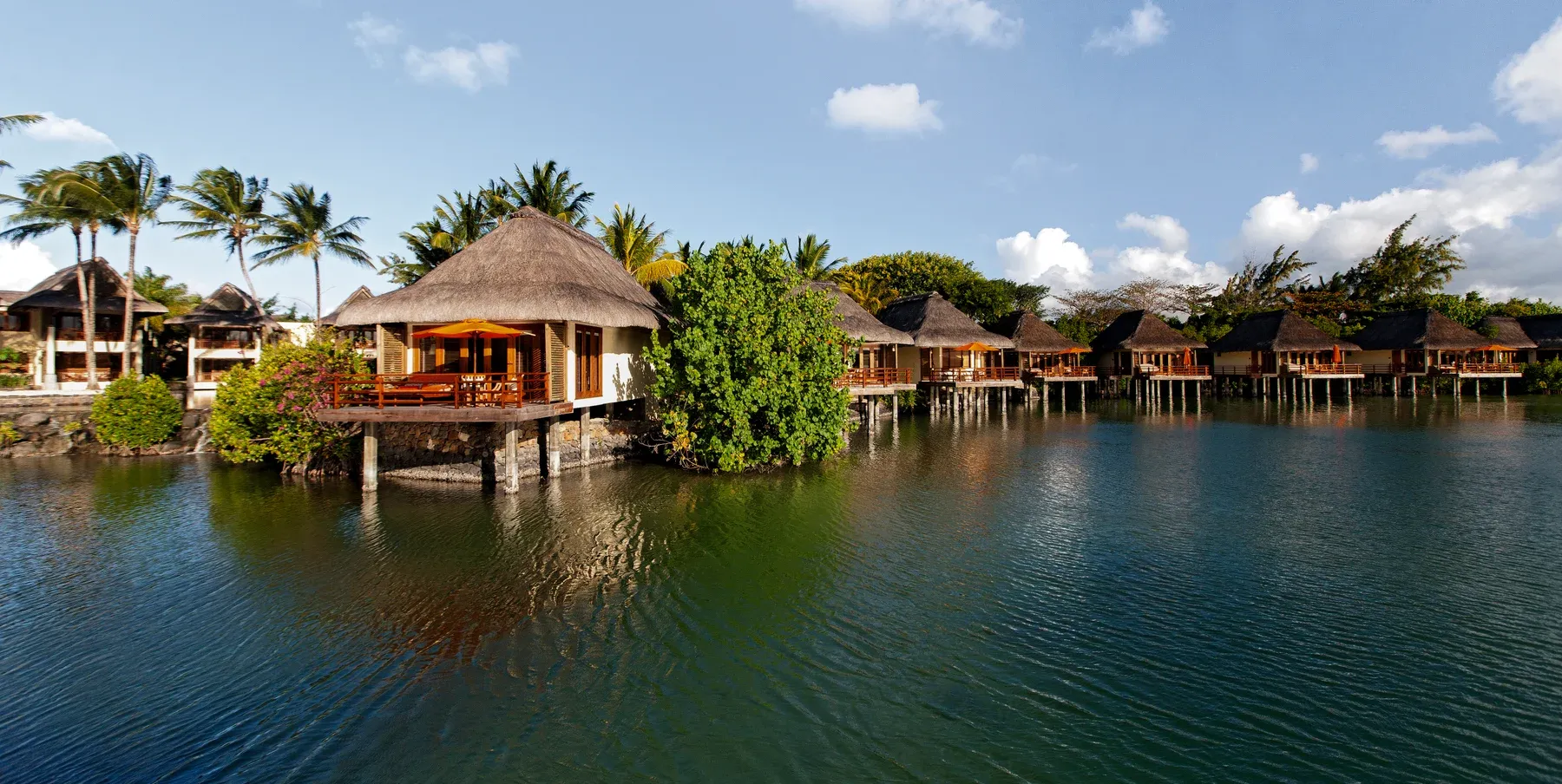 Sleep over the lagoon — the activity/scene in action. Suites on stilts above a protected fish reserve.