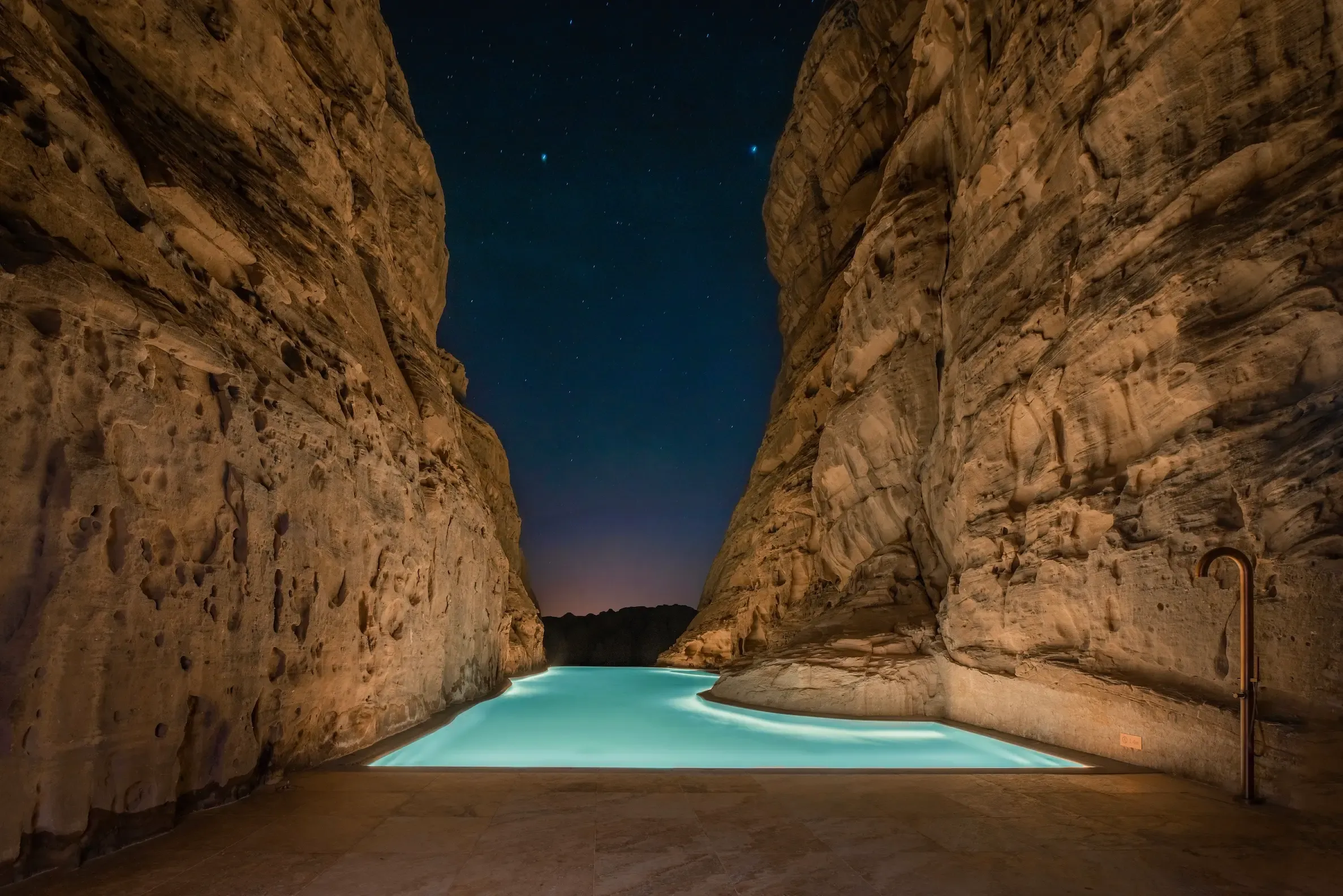The Rock Pool: Carved between sandstone cliffs.