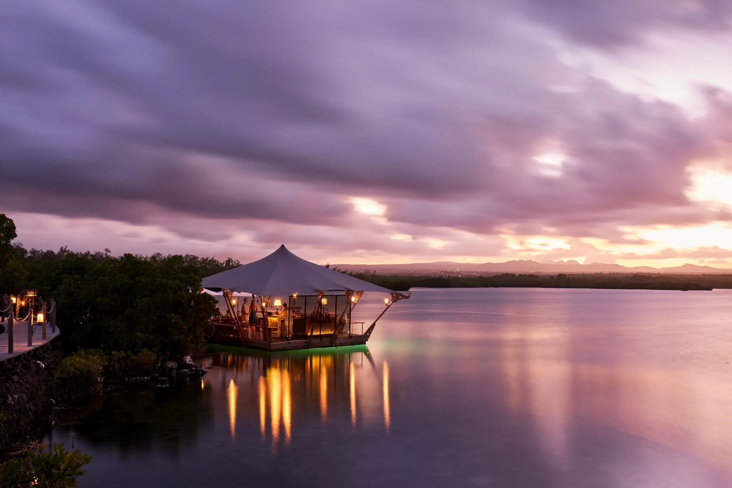Dine on the water — the activity/scene in action. Le Barachois, floating out over the lagoon.
