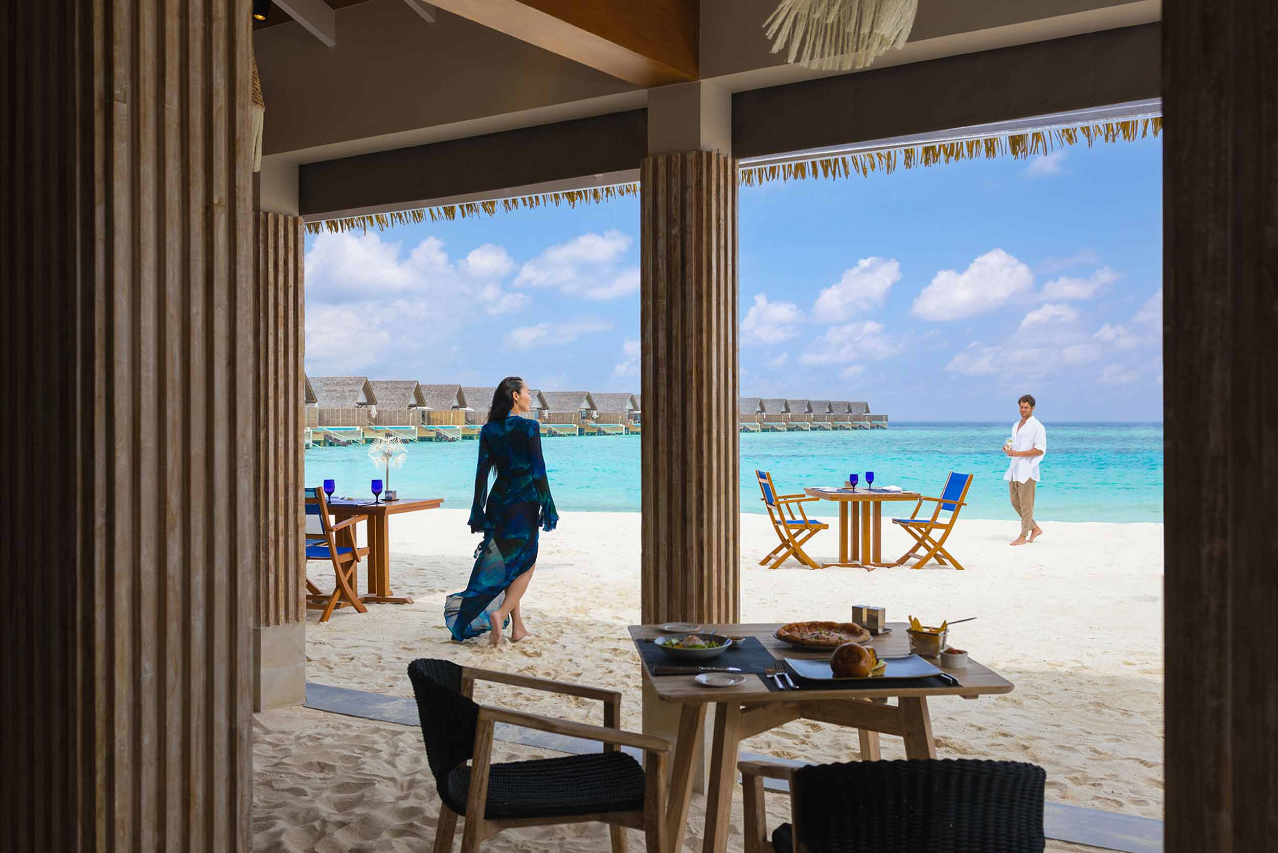 Churrascaria on the sand — the activity/scene in action. A beachside Brazilian grill among the restaurants.
