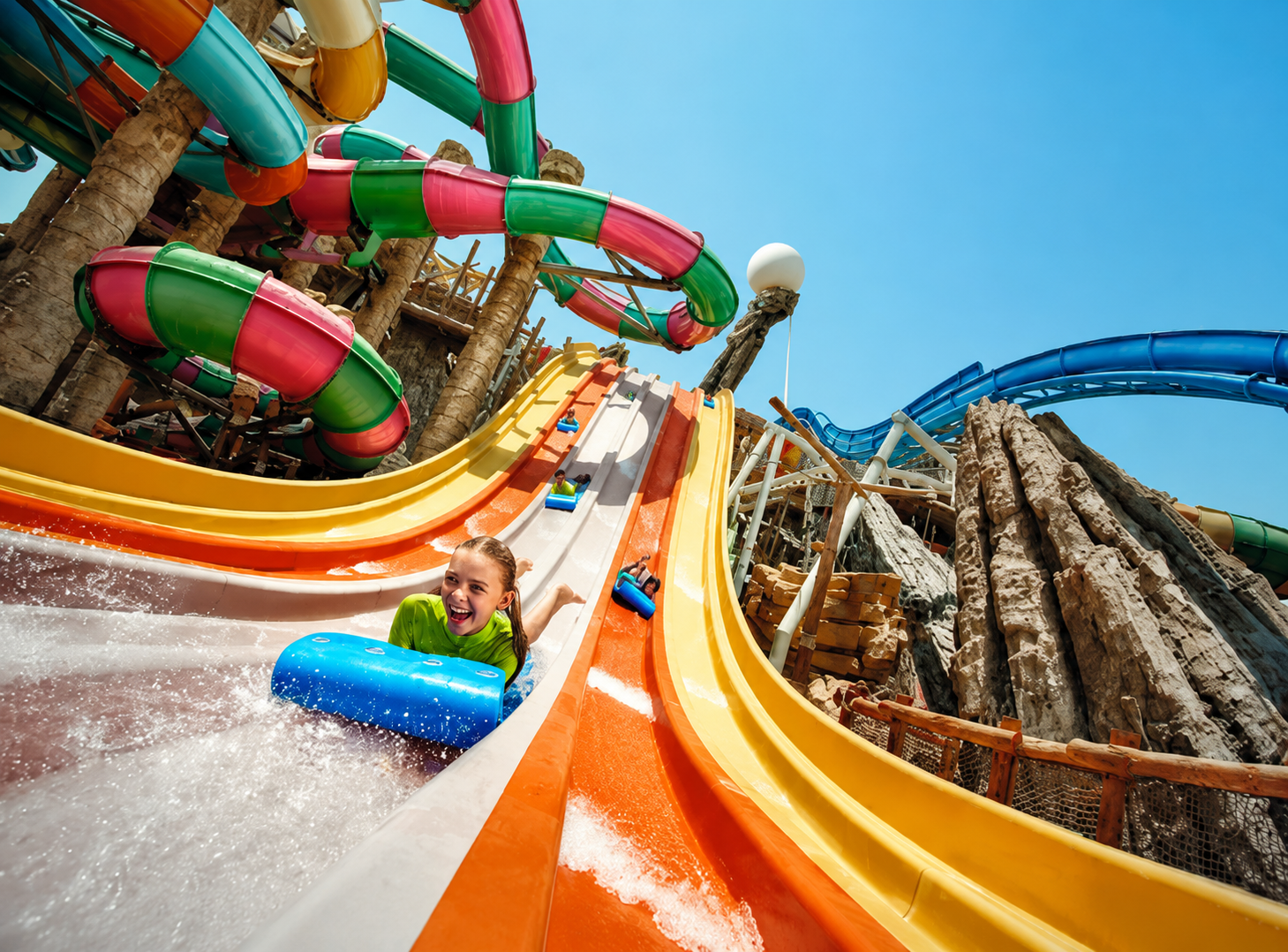 Yas attractions: Ferrari World, Yas Waterworld and Warner Bros World nearby.