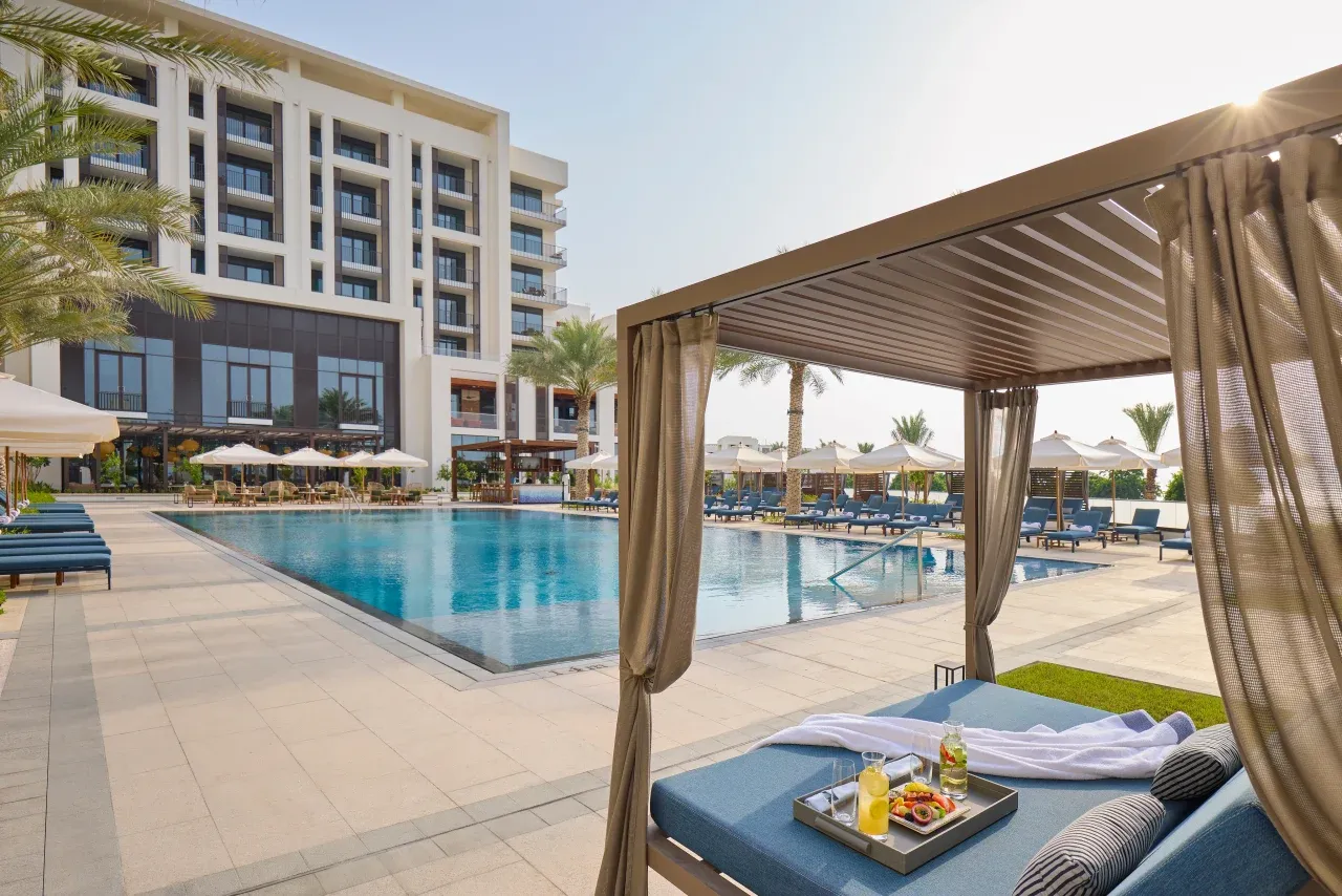 Hero/establishing shot of Mandarin Oriental, Muscat, Muscat, Oman. A new prestige icon on Shatti Al Qurm’s beach promenade, next to the Royal Opera House — contemporary Omani-inspired design by Xavier Cartron, with unusually large marble rooms.