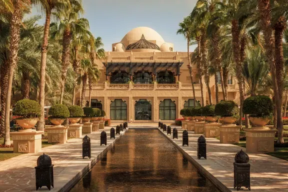 Hero/establishing shot of One&Only Royal Mirage, Dubai. A timeless Arabian-palace beachfront resort across three distinct houses in 65 acres of gardens, with a kilometre of private beach.