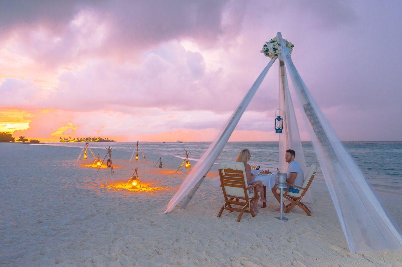 A dinner for two on a private motu, your feet in the sand and the lagoon all around