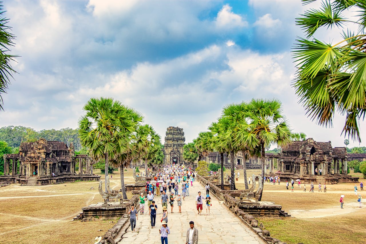 The world's largest religious monument, mirrored in its moat as the sun comes up behind its towers