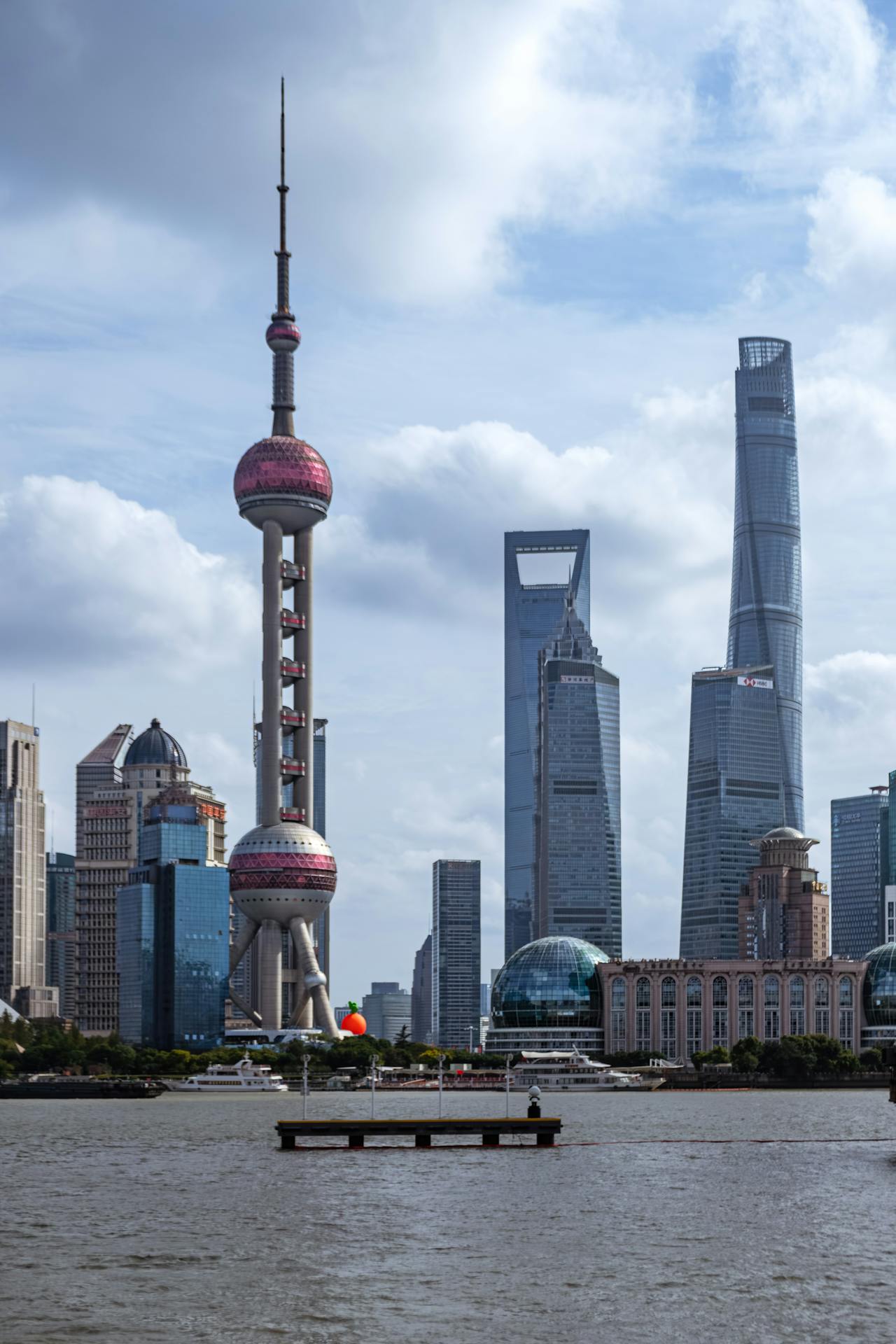 The colonial Bund facing the soaring Pudong skyline across the river, the old town gardens and the rooftop bars