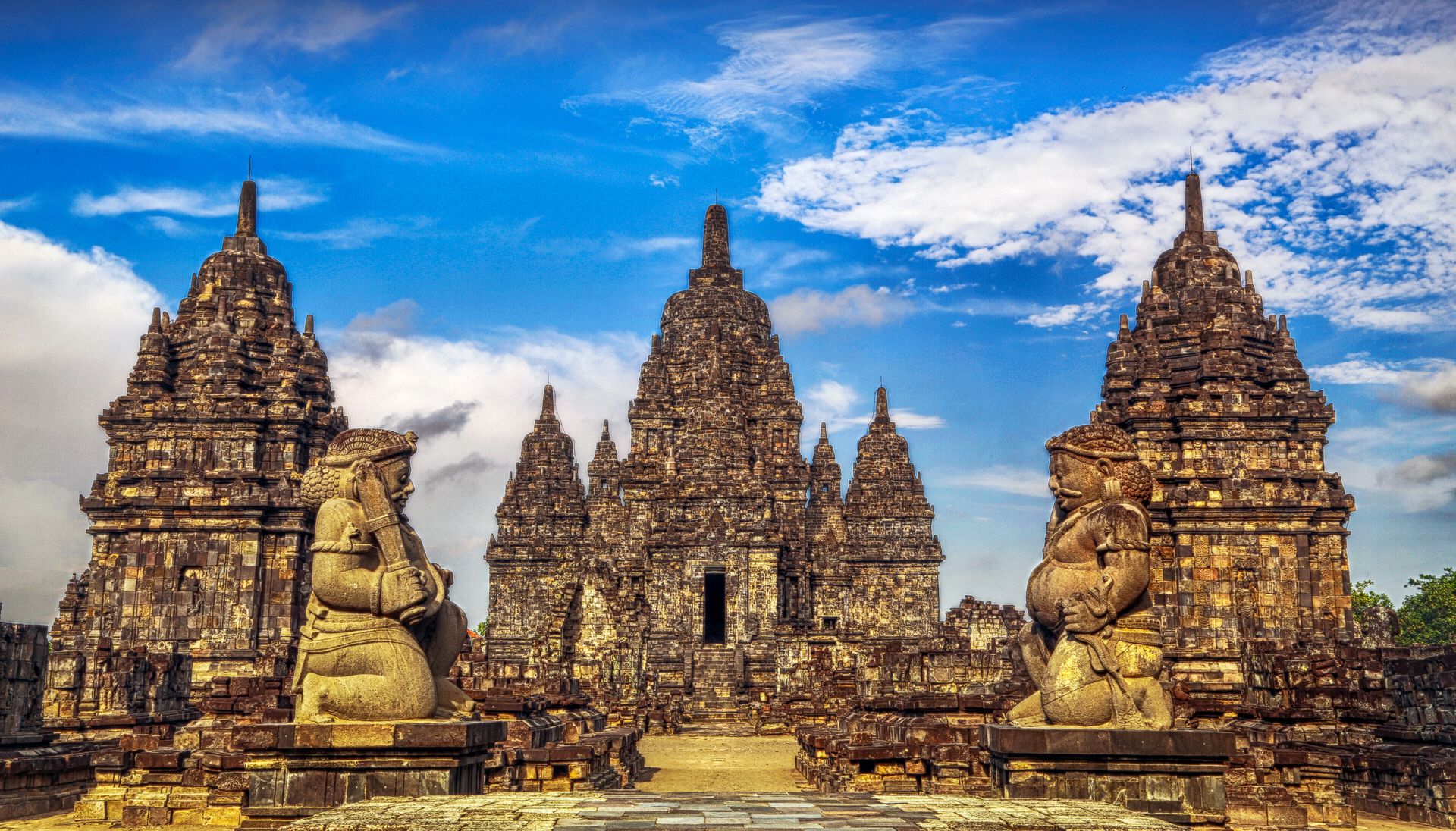 Sunrise over Borobudur, the largest Buddhist temple on earth, and the nearby Hindu temples of Prambanan