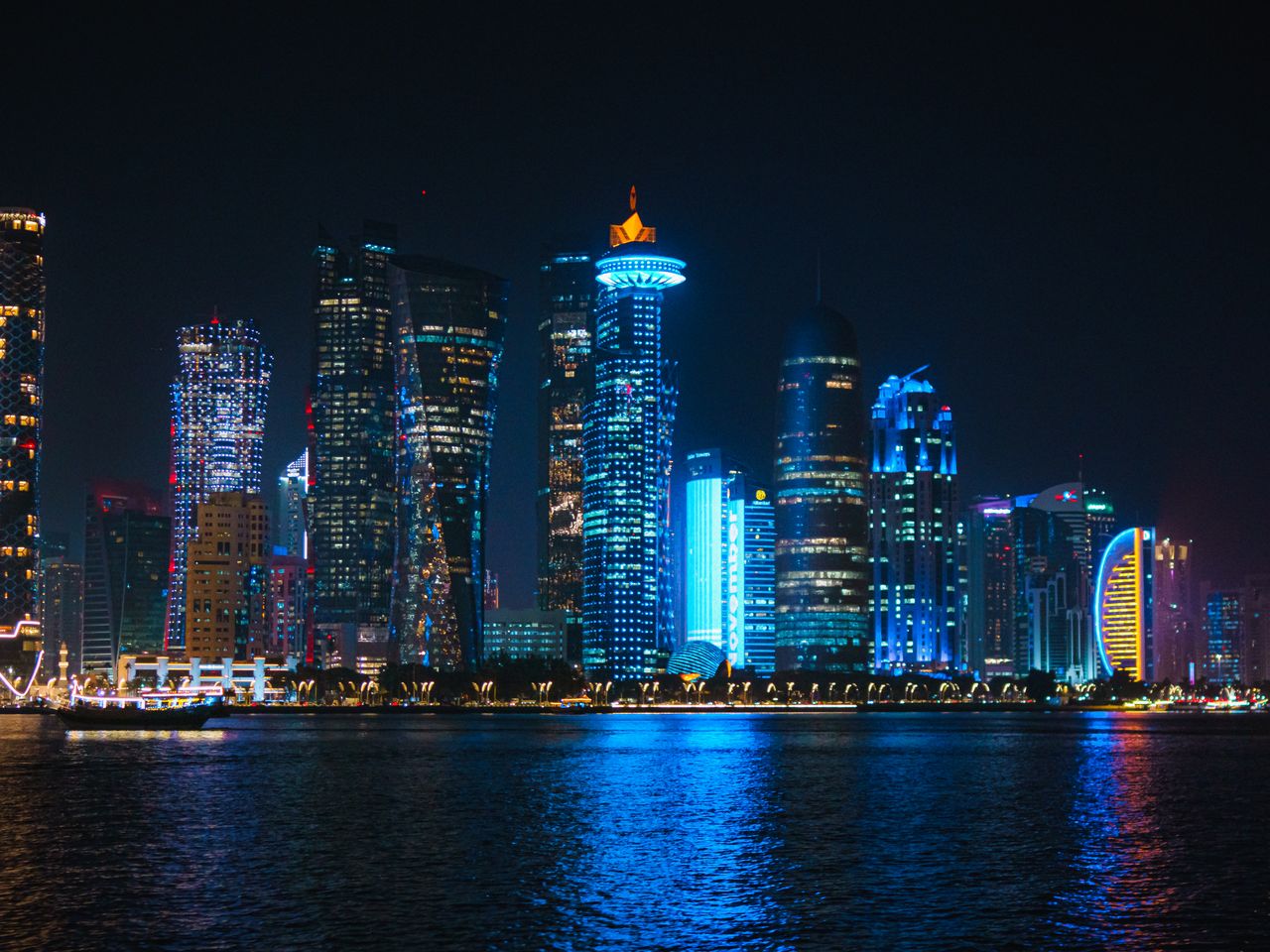 A seven-kilometre waterfront promenade curving below the West Bay skyline