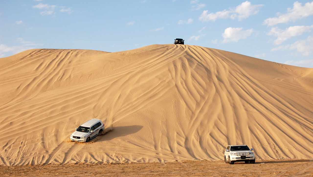 The Hajar Mountains meet the desert here, with dune drives, camel treks and stargazing camps