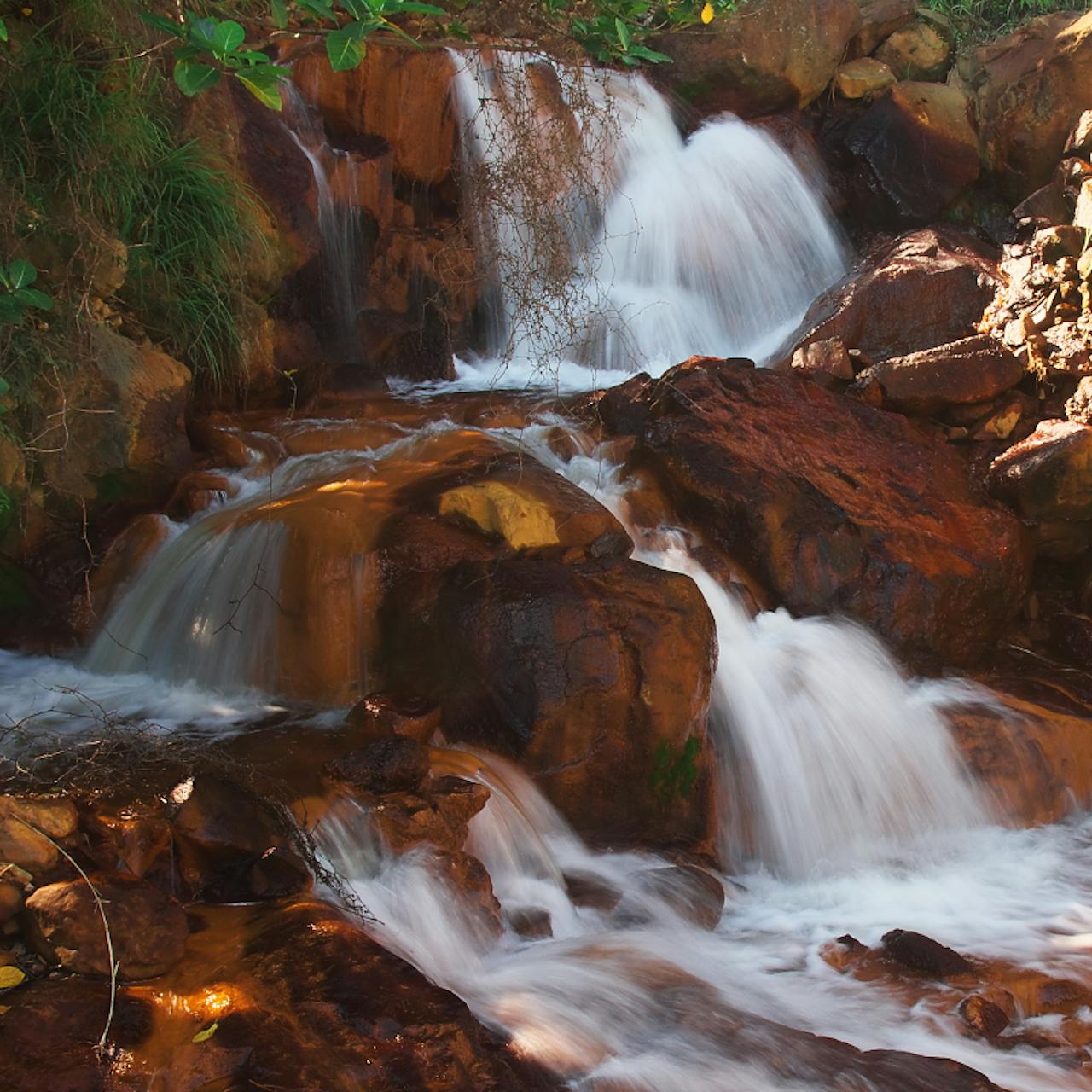 Drive into the caldera of a dormant volcano at Soufriere, then bathe in warm mineral mud pools said to soften…
