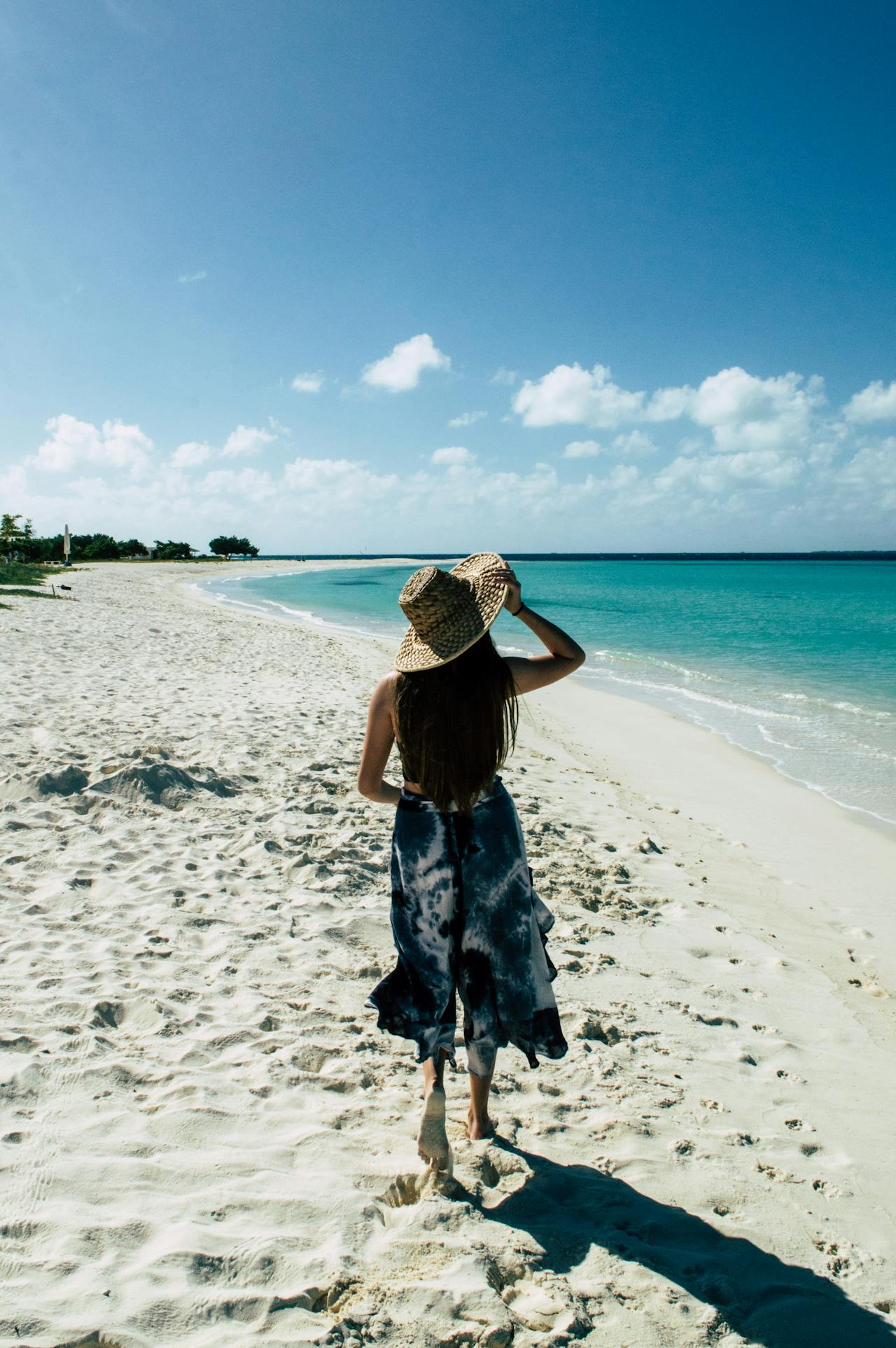 Twelve miles of flour-white sand and luminous turquoise, sheltered by a barrier reef and regularly voted the world's finest beach