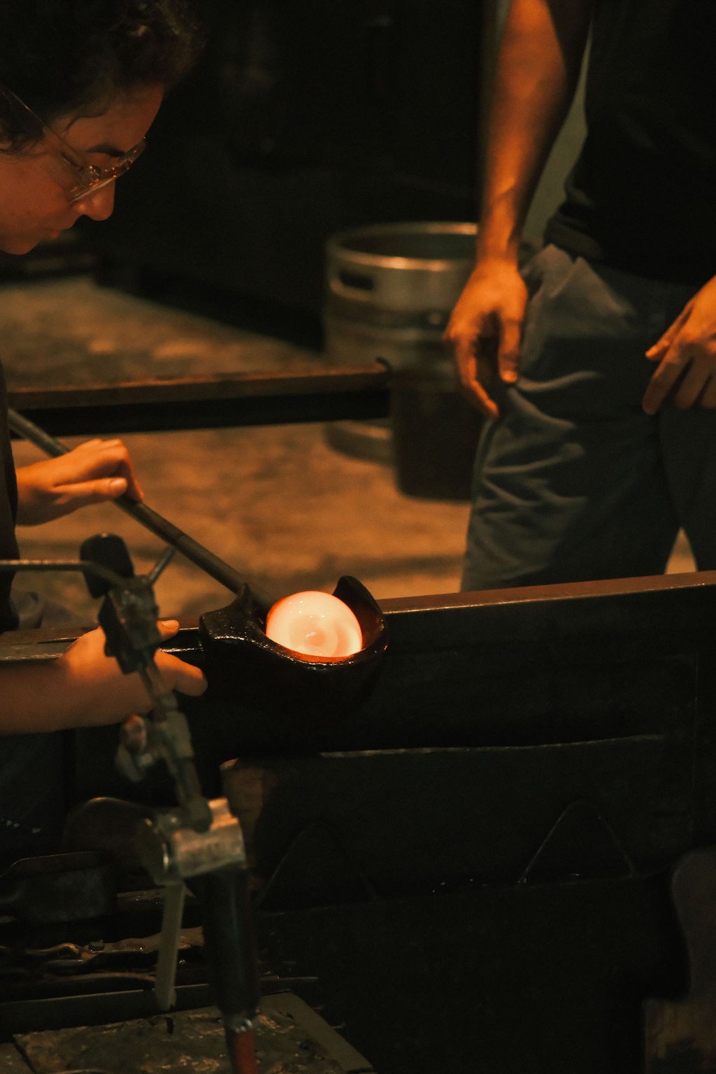 Soneva Art & Glass — the activity/scene in action. A working glass-blowing studio with visiting international glass artists.
